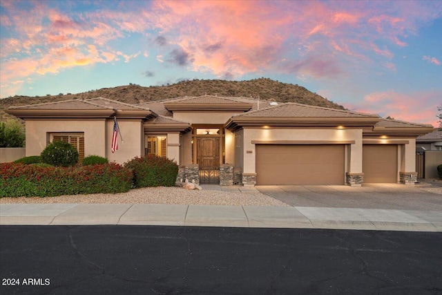 prairie-style house featuring a garage