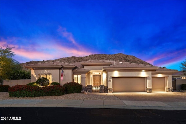 prairie-style home featuring a garage