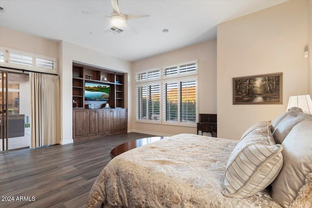 bedroom featuring access to exterior, ceiling fan, and dark hardwood / wood-style flooring