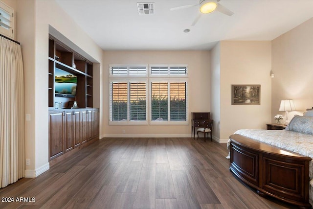 unfurnished bedroom featuring dark hardwood / wood-style flooring and ceiling fan