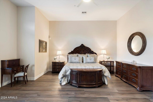 bedroom featuring ceiling fan and dark hardwood / wood-style flooring