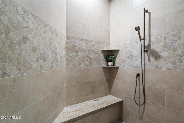 bathroom featuring a tile shower