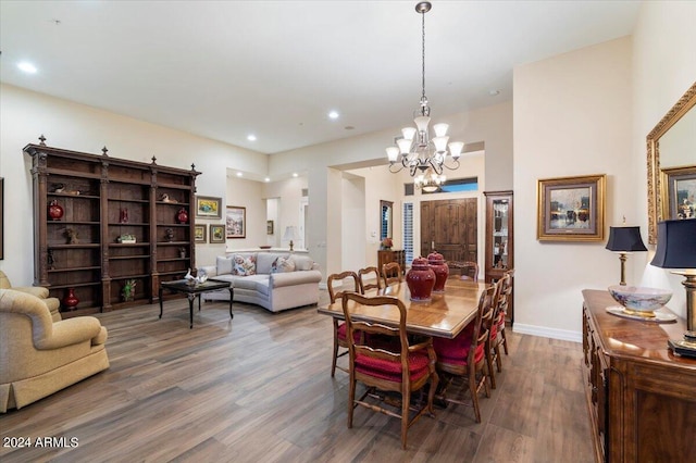 dining room with a chandelier and wood-type flooring