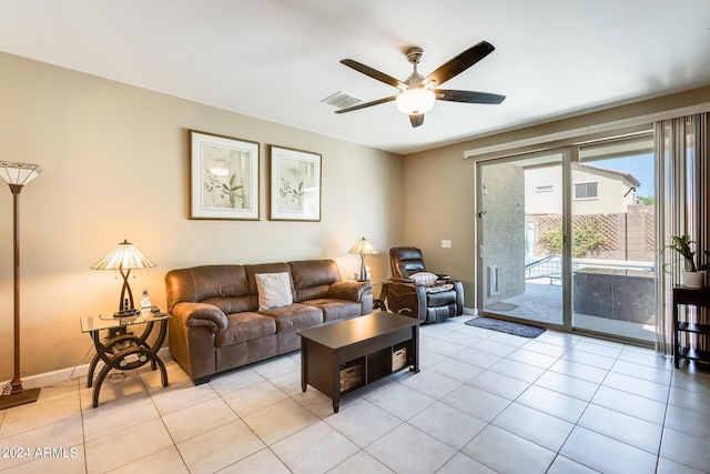 living room featuring light tile patterned floors and ceiling fan