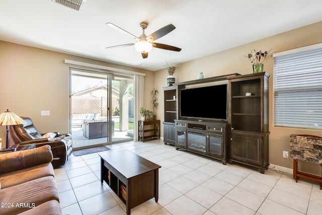 tiled living room with ceiling fan