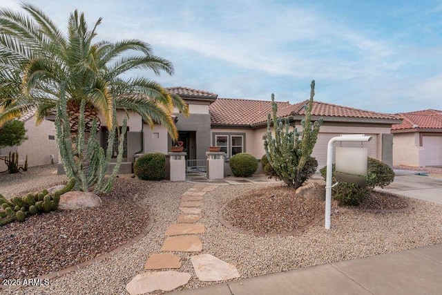 mediterranean / spanish-style house featuring a garage