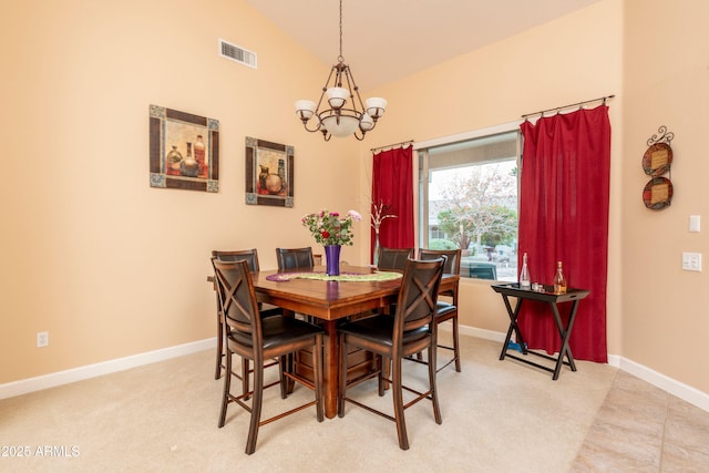 dining room featuring lofted ceiling and a chandelier