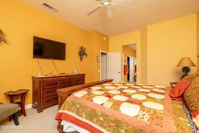 bedroom with ceiling fan and light carpet