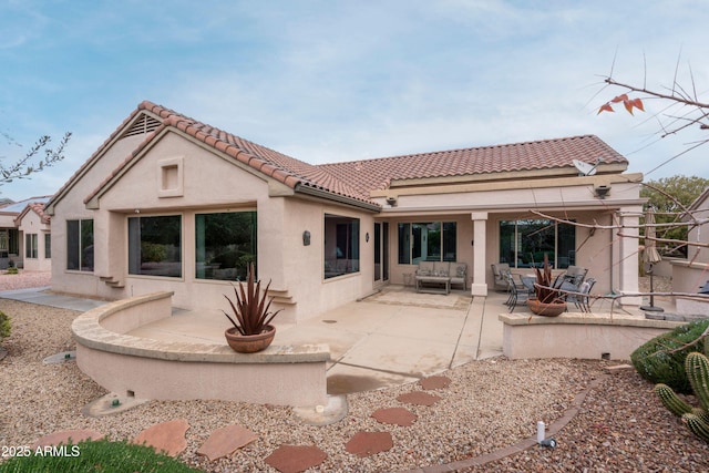 back of house with a patio