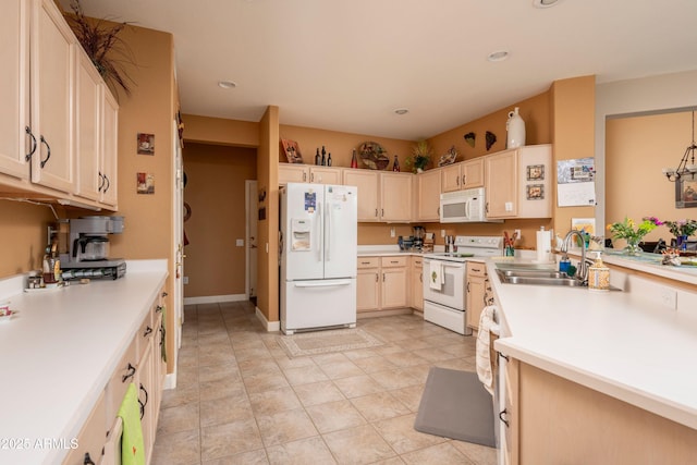 kitchen with sink, white appliances, and light tile patterned floors