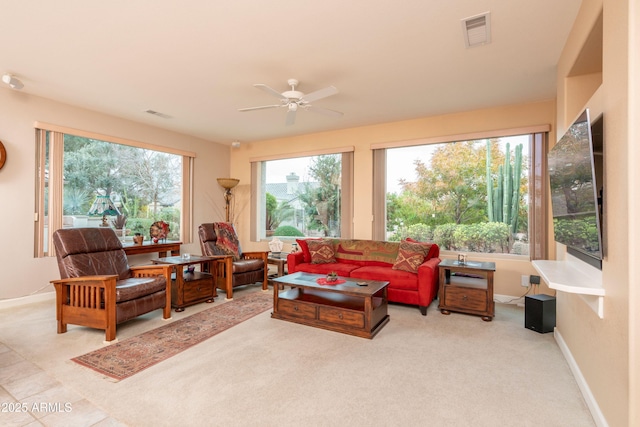 carpeted living room featuring ceiling fan