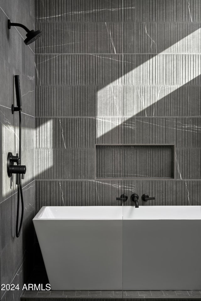 5939 E Orange Blossom Ln, Phoenix, AZ 85018 - bathroom featuring a freestanding tub, a tile shower, and tile walls