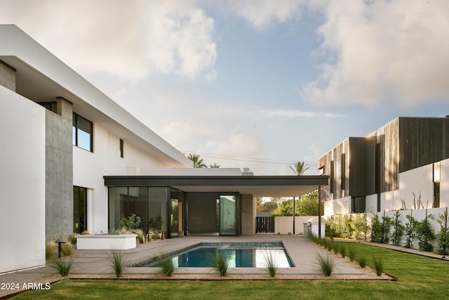 view of swimming pool featuring a patio area