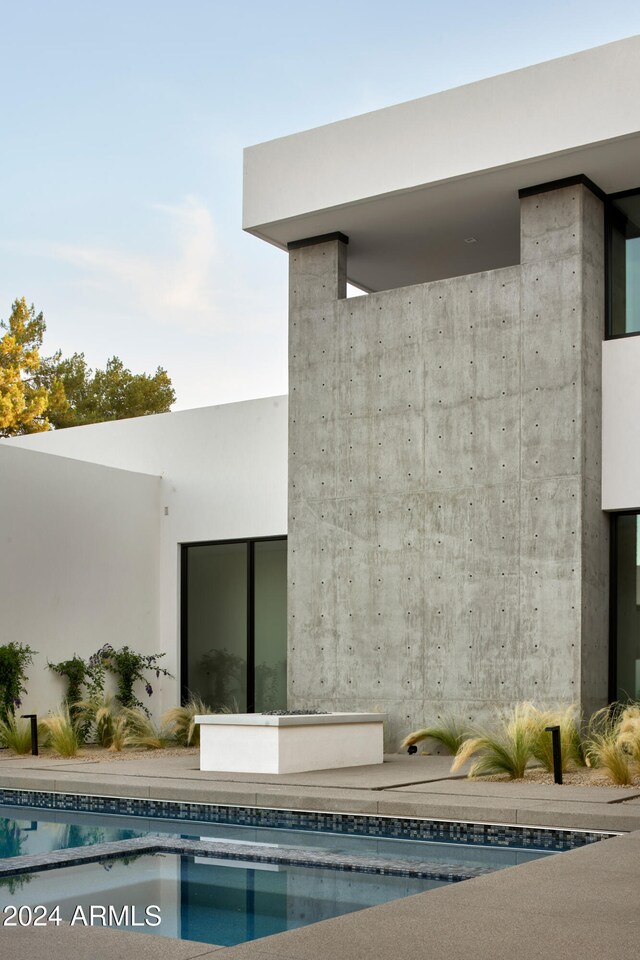 5939 E Orange Blossom Ln, Phoenix, AZ 85018 - rear view of property featuring an outdoor pool