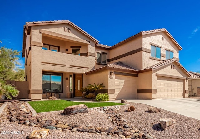 view of front of home with a balcony and a garage