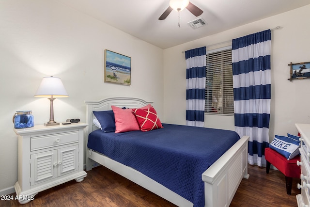 bedroom with ceiling fan and dark hardwood / wood-style flooring