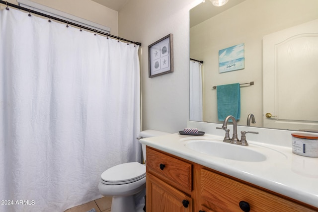 bathroom with tile patterned floors, vanity, and toilet