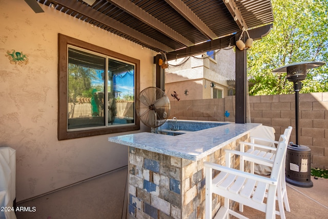 view of patio / terrace with an outdoor bar