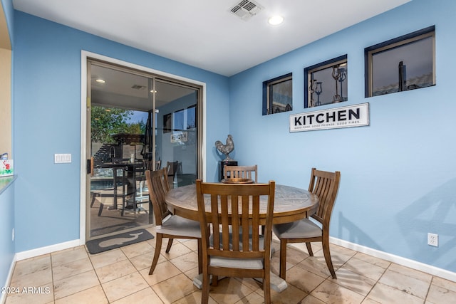 dining area with light tile patterned flooring