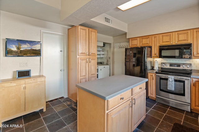 kitchen with tasteful backsplash, a kitchen island, light brown cabinets, black appliances, and washer and dryer