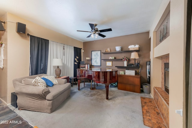 carpeted office featuring ceiling fan