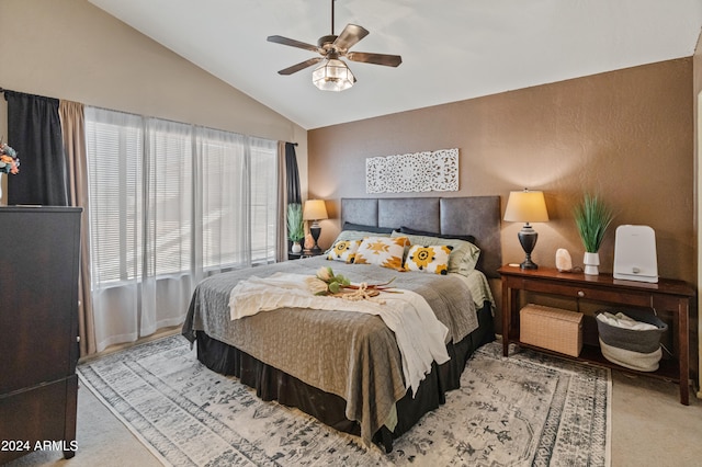 carpeted bedroom with lofted ceiling and ceiling fan