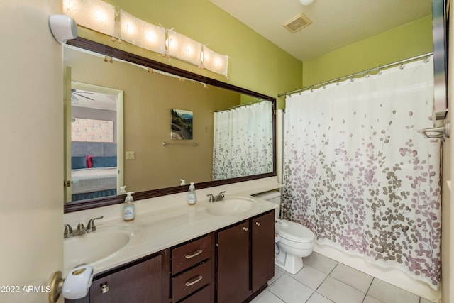 full bathroom with shower / bathtub combination with curtain, tile patterned floors, ceiling fan, vanity, and toilet