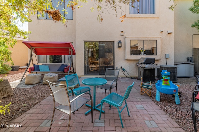 view of patio featuring a grill