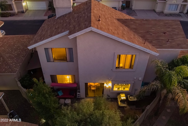 back of property featuring a garage