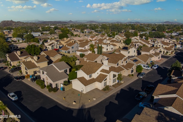 birds eye view of property with a mountain view