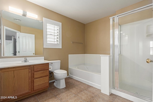 full bathroom with tile patterned flooring, vanity, a healthy amount of sunlight, and toilet