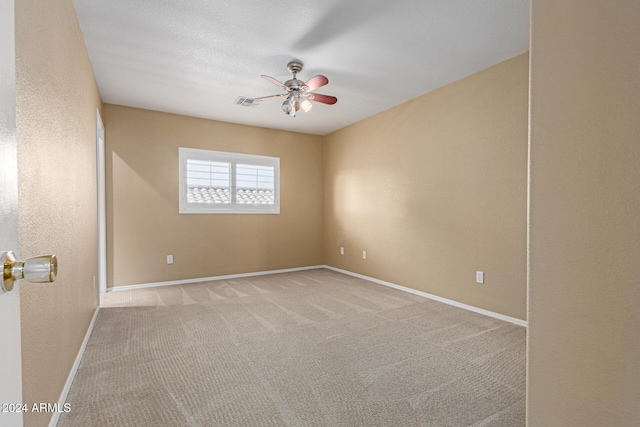 empty room featuring light colored carpet