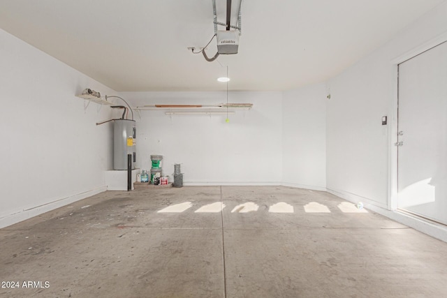 garage with a garage door opener and water heater