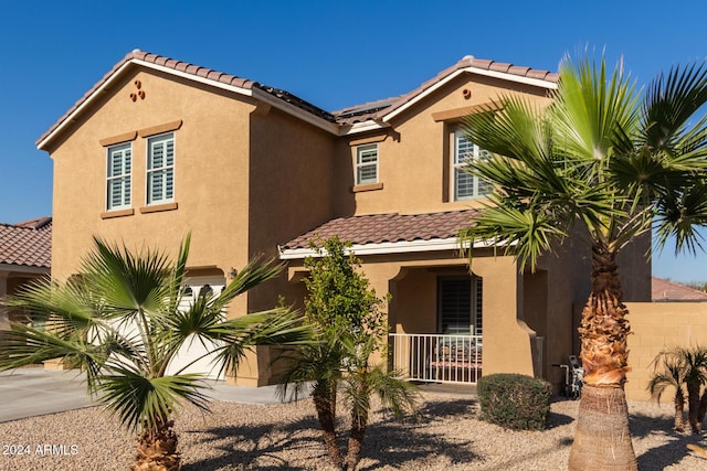 mediterranean / spanish-style house featuring a porch