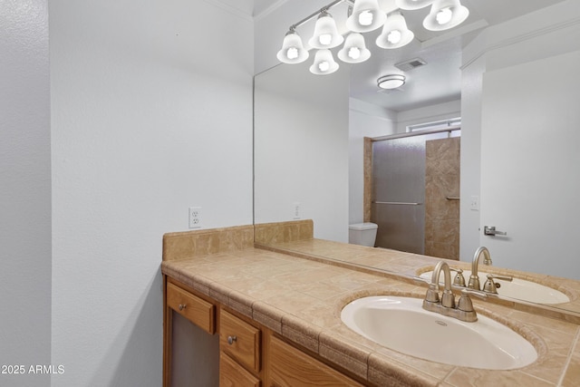 full bathroom with visible vents, vanity, and an enclosed shower