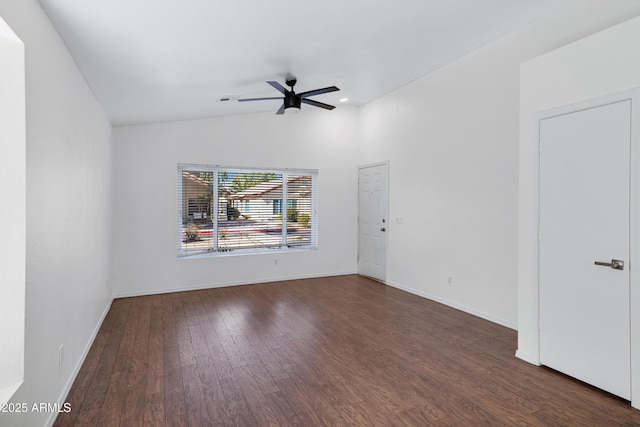 unfurnished room with lofted ceiling, baseboards, a ceiling fan, and wood finished floors