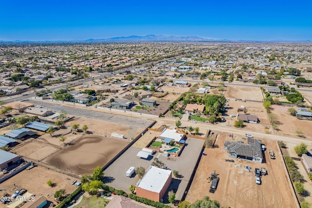 drone / aerial view featuring view of desert and a mountain view