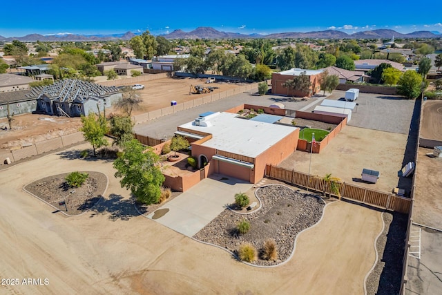 birds eye view of property with a mountain view