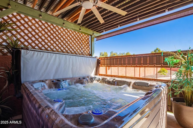 wooden deck featuring a fenced backyard and a ceiling fan