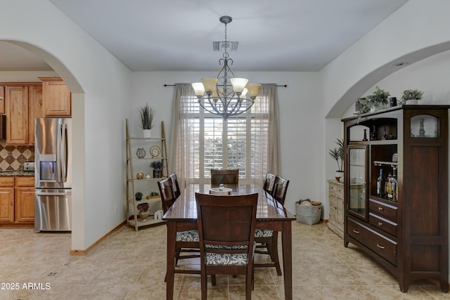 dining room featuring a chandelier