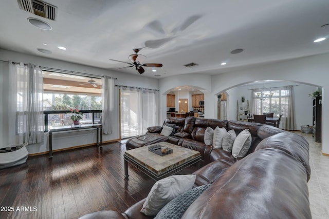 living room featuring dark hardwood / wood-style floors and a notable chandelier