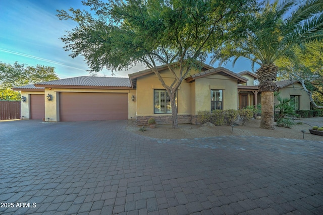 view of front of property featuring a garage