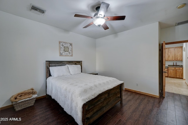 bedroom with dark wood-type flooring and ceiling fan