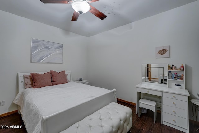 bedroom with dark hardwood / wood-style floors and ceiling fan