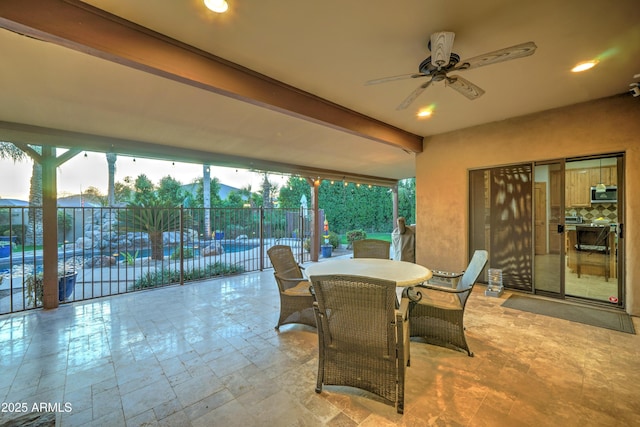 view of patio featuring ceiling fan