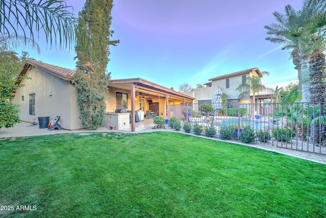 view of yard with a patio area and exterior kitchen