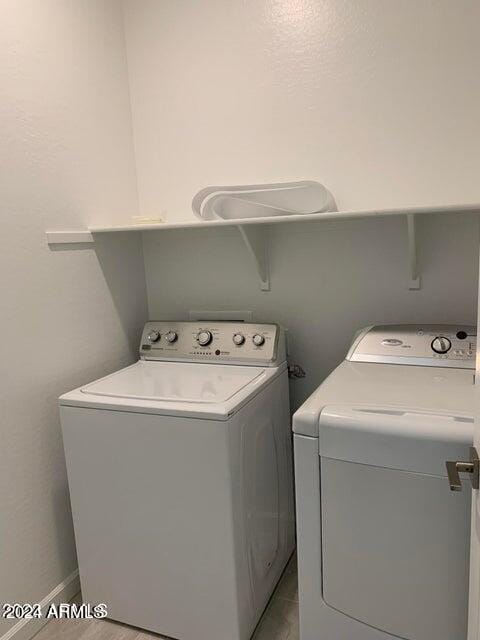 washroom with washer and clothes dryer