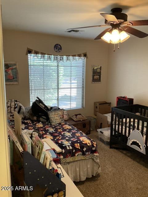 bedroom featuring carpet and ceiling fan