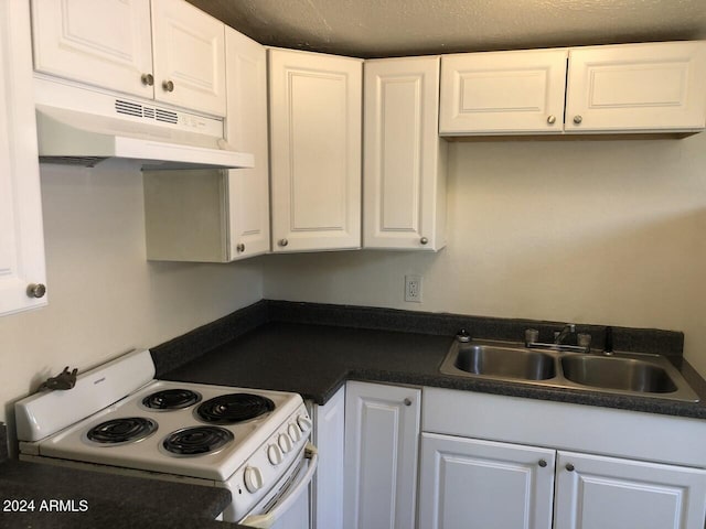 kitchen with white cabinetry, white electric range, and a textured ceiling