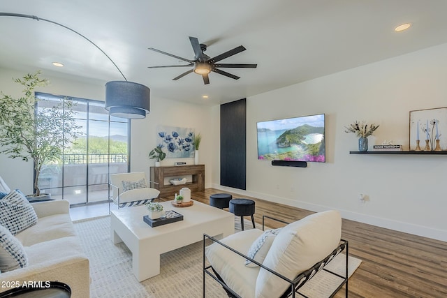 living room with recessed lighting, ceiling fan, and wood finished floors